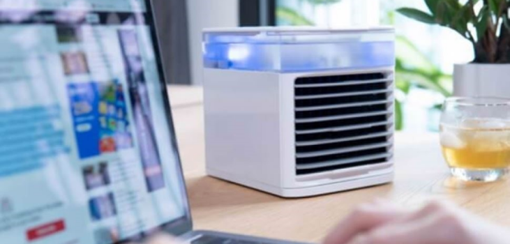 Image of Ultra Air Cooler on a desk of a person working on their laptop